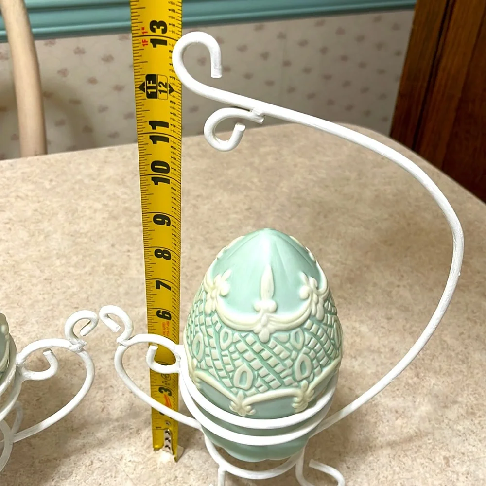 VINTAGE SET OF 2 VASES/PLANTERS ON WHITE PAINTED METAL SCROLL TABLE TOP STANDS.